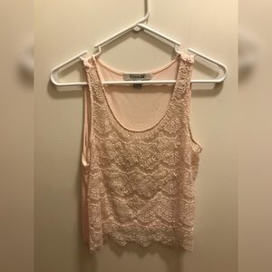 A pink Forever 21 cropped see through shirt